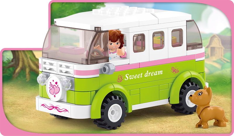 A box of Sluban building blocks from the "Girl's Dream" series featuring a girl with a brown dog, a green and white camper van, and 179 pieces. The set is for ages 6 and up.